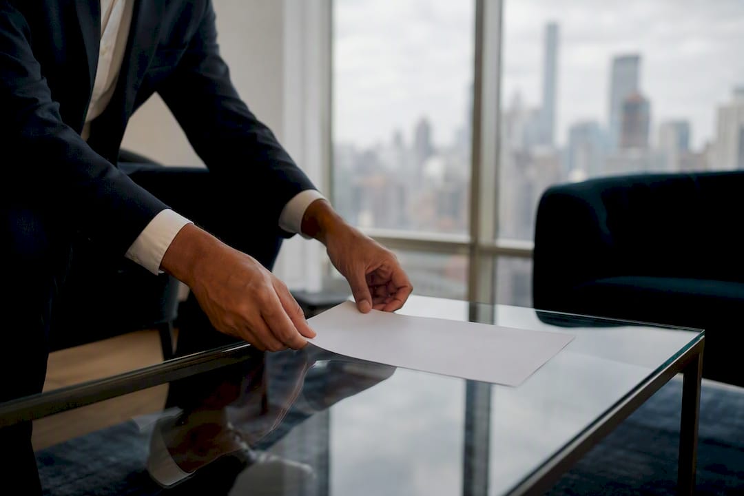 Hands with pen on lease consent form