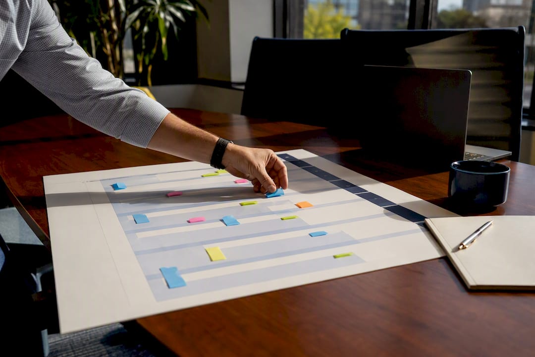 Hand organizing lease expiry timeline with flags