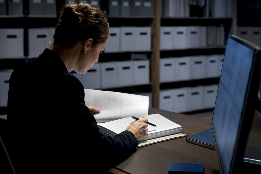 Administrator reviewing lease dates and source documents
