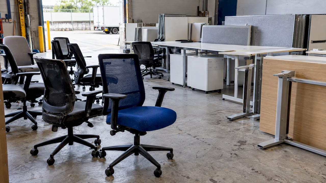 Office chairs and desk components awaiting assessment